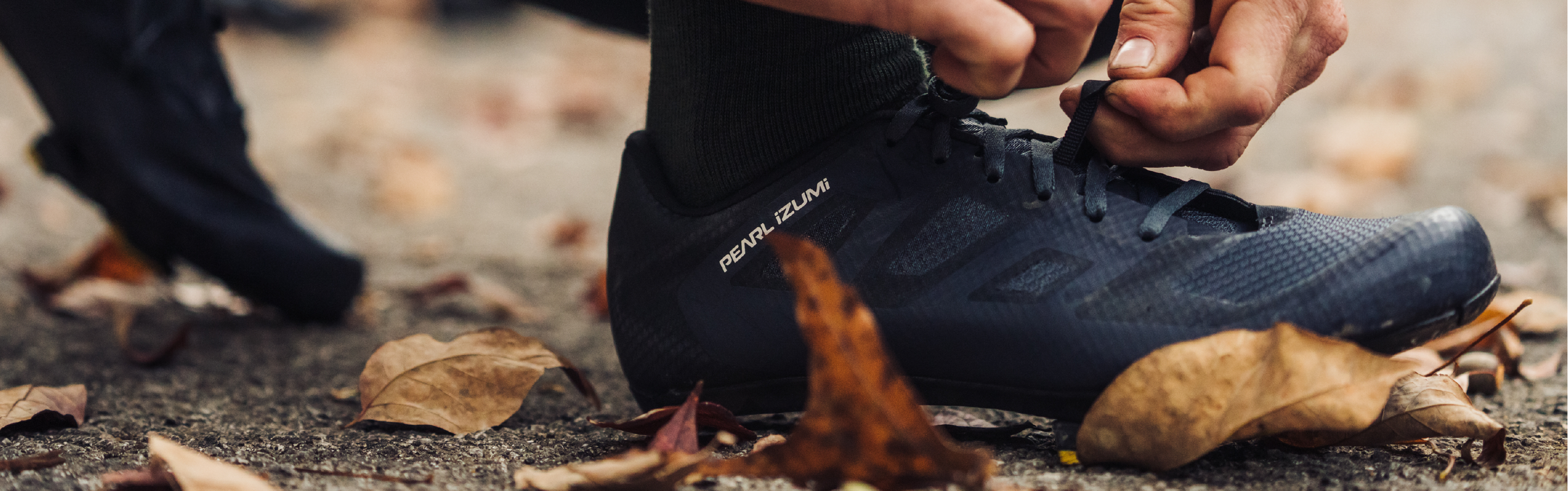 Rider Tying Shoe Laces on Cycling Shoes